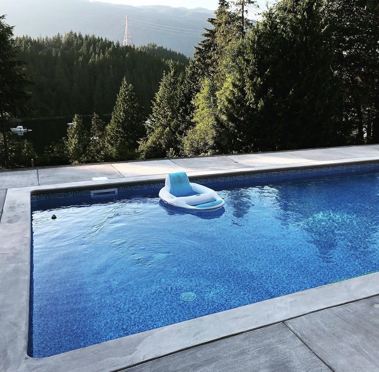 Backyard pool with mountain and inlet views serviced by JK Pools and Spas